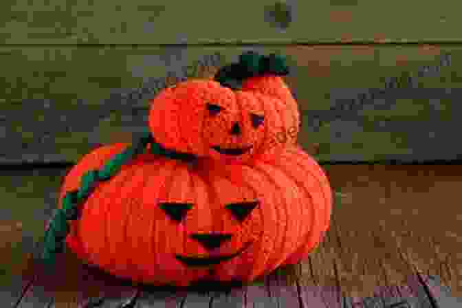 A Classic Crocheted Jack O' Lantern With A Wide Grin And Triangular Eyes Crochet Adorable Pumpkins: Amigurumi Pumpkin Patterns For Halloween: Crochet Pumpkin Patterns