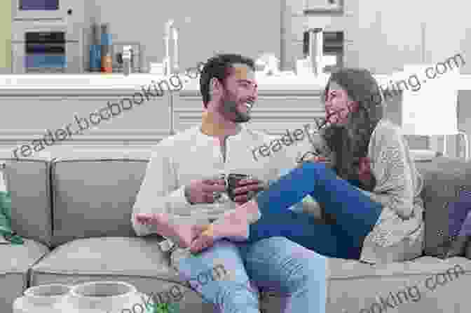 A Couple Sitting On A Couch, Laughing And Looking Happy. Threesome Tips: The Readiness Guide For Couples Looking To Open Their Relationship To A Unicorn Woman