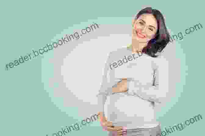 A Happy Pregnant Woman Holding Her Belly While Smiling The Fertility Book: Your Definitive Guide To Achieving A Healthy Pregnancy