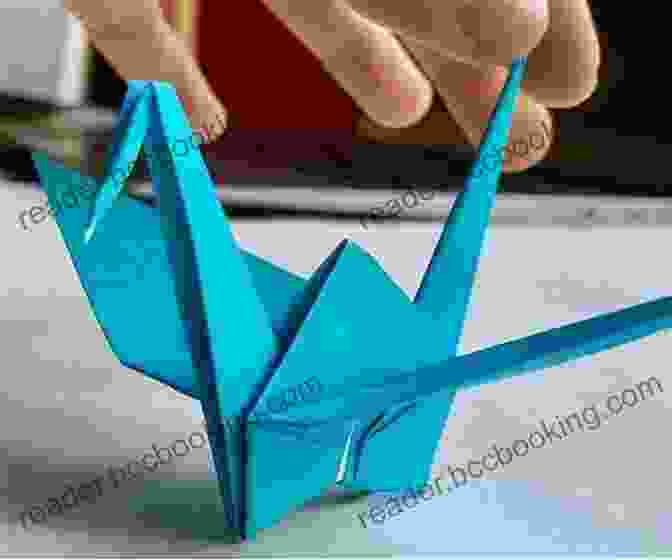 A Person Making An Origami Crane, With The Paper Folded And Shaped Into A Bird's Body And Wings 31 Things To Do When You Are Free