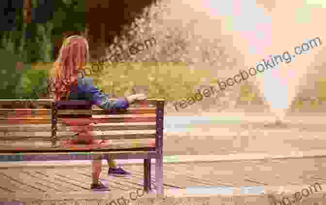 A Woman Sitting On A Bench In A Park, Looking Out At The Water. She Is Holding A Book In Her Lap And Has A Peaceful Expression On Her Face. On Consolation: Finding Solace In Dark Times