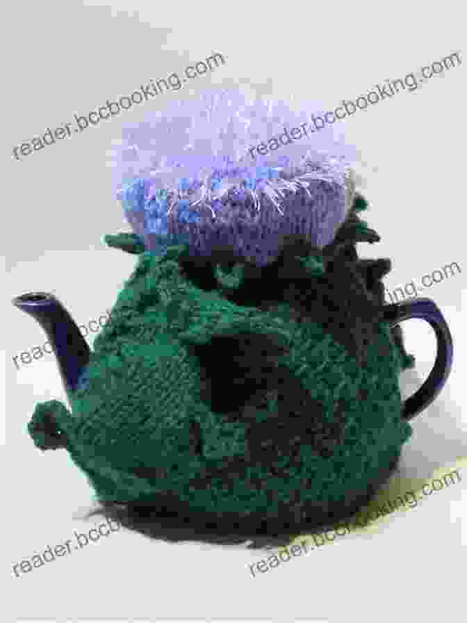 An Image Of A Knitted Scottish Thistle Tea Cosy In Use, Effectively Keeping A Teapot Warm And Adding A Touch Of Scottish Charm To The Tea Table. Scottish Thistle Tea Cosy Knitting Pattern