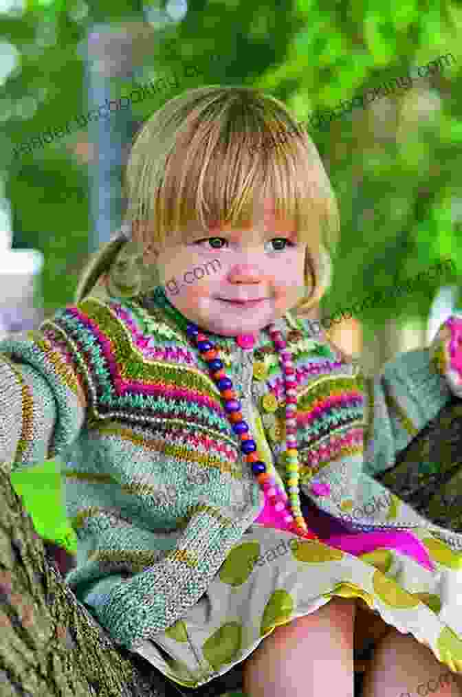 Child Wearing A Knitted Cardigan With Colorwork Knitting Pattern KP452 Childs Cardigan 3 Sizes USA Terminology